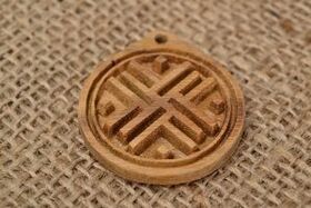 Good luck talisman made of wood and burlap. 