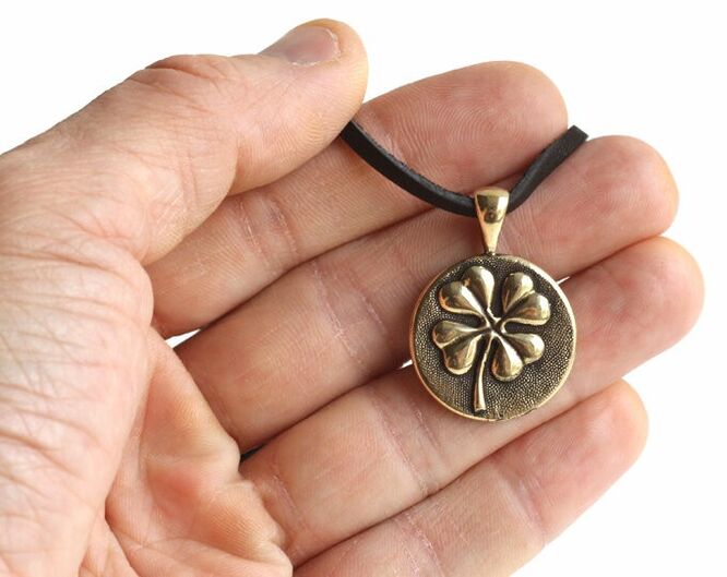 four leaf clover amulet brings good luck and love