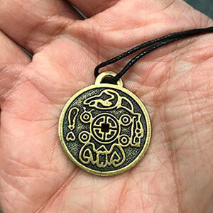 the amulet in the palm of the hand